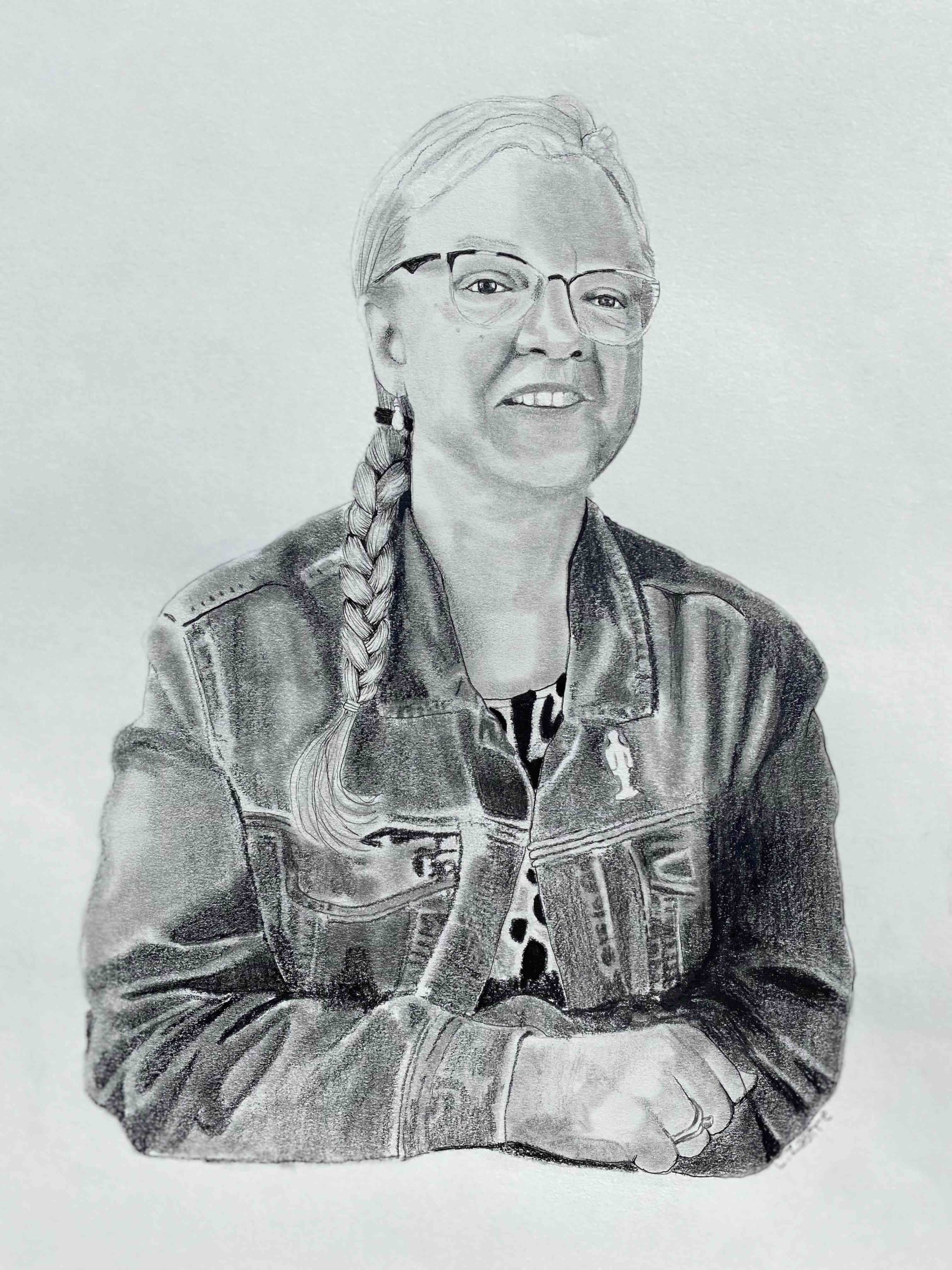 This is a drawing of a woman. She is wearing a jean jacket and glasses. Her hair, in a long white braid, falls over her shoulder. She is smiling.