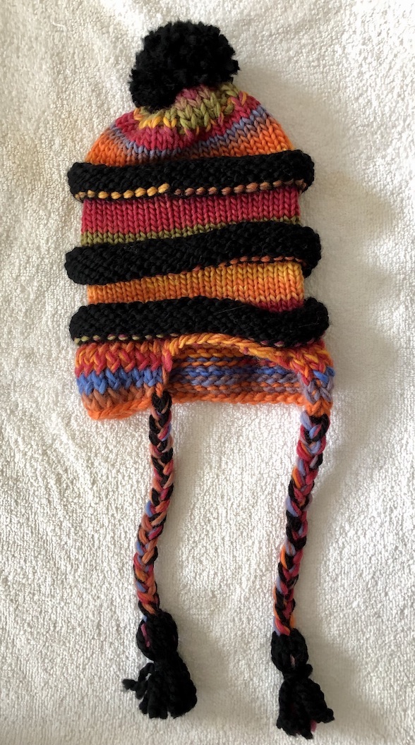 Image of a slouchy Multi coloured and black knit hat