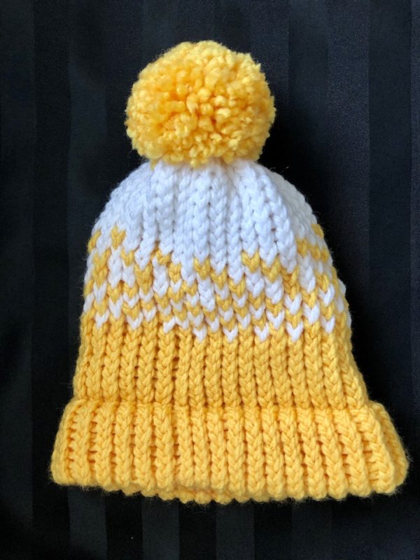 Image of a Yellow and white knit hat