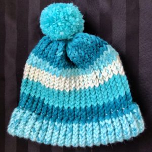Image of a Turquoise hued knit hat