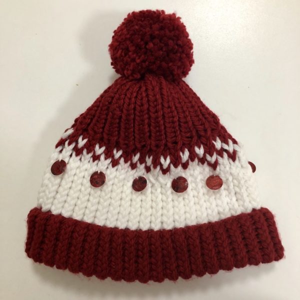 Image of a dark red and white knit hat