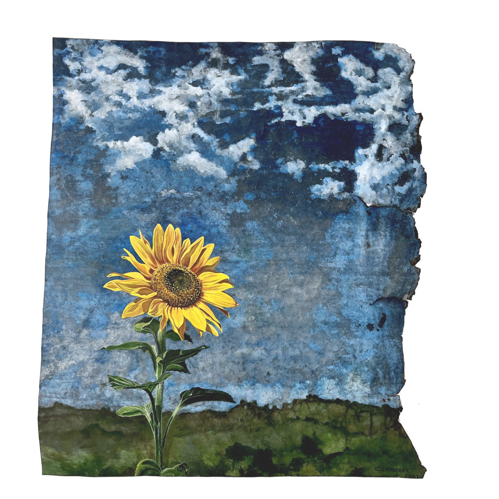 This is a photo of an artwork. A sunflower in a green field with a blue sky with acrylic on recycled tin.