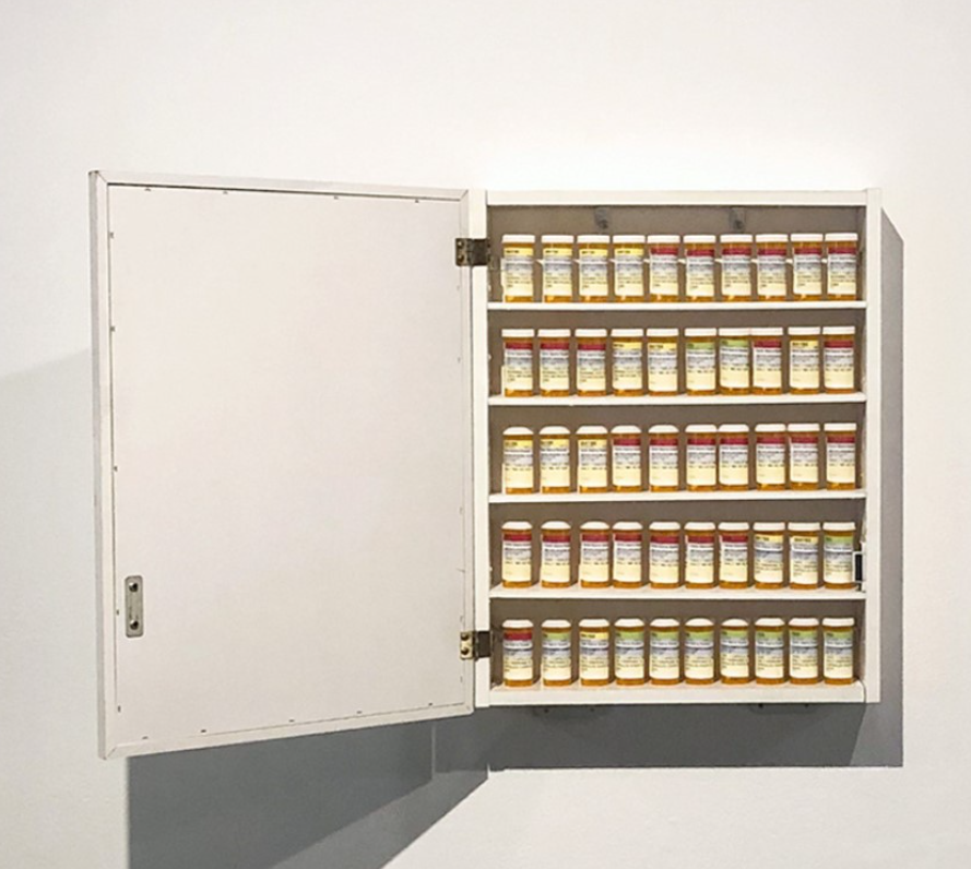 This is a photograph of a medicine cabinet filled with prescription medication.