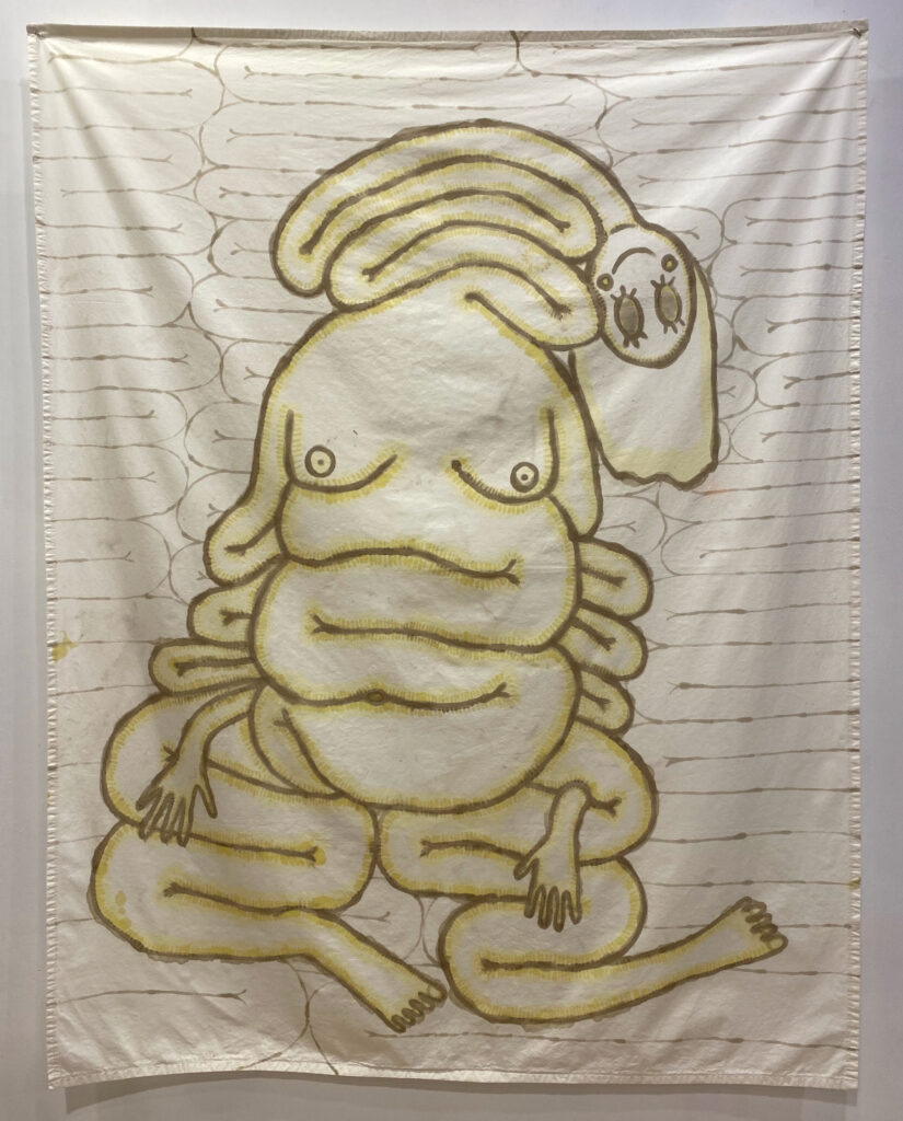 A warm gray outline of a distorted human form with stretched, tangled and meandering limbs and torso. The head falls to the left side and has large, round, blank eyes and a small smile. The folded stretched limbs falling to the bottom, with the appearance of crossed legs. There is yellow inside of the outline, giving soft colour and texture. There is a faint gray background of cylinders meandering. 