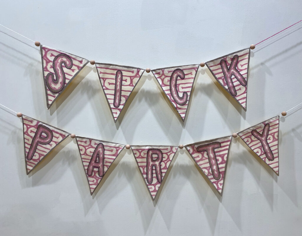 Triangular shaped bunting has gray bubble lettering spelling “Sick Party” outlined with purple embroidery. Fuschia blobby shapes appear behind the letters on the bunting. 