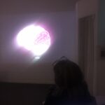 At the opening of Da Silva's animation show, seated visitors look on in the darkened gallery, towards the digital drawing of a purple and white brain projected larger than life on the wall, above the caption "what."