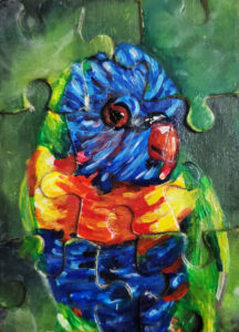 Painting of a puzzle. The puzzle is complete and depicts a parrot in bright blue, red, yellow and green feathering.