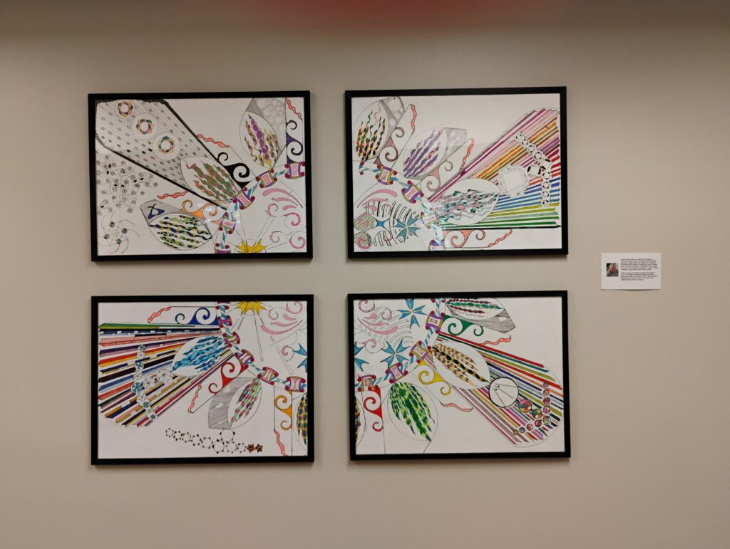 Photograph of four panels of artwork featuring geometric shapes and many colours
